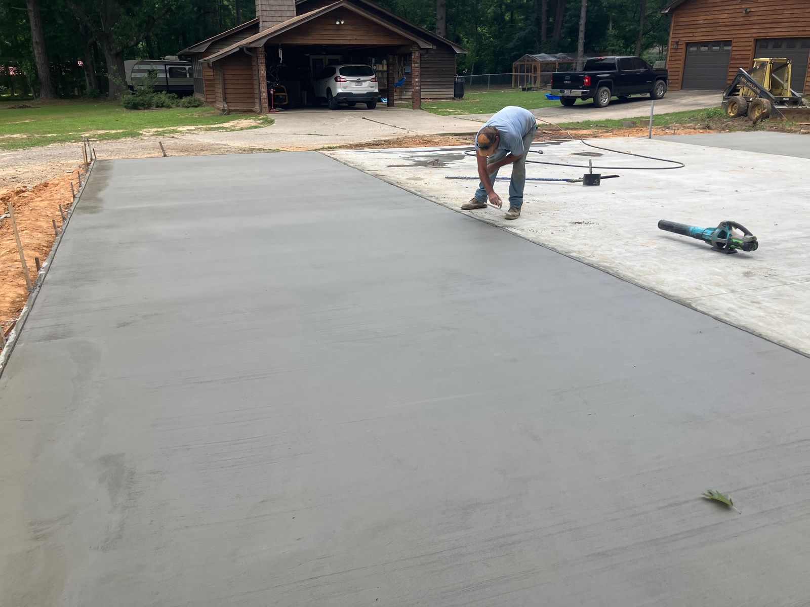 Rose Stone crew finishing a new concrete driveway in Arkansas