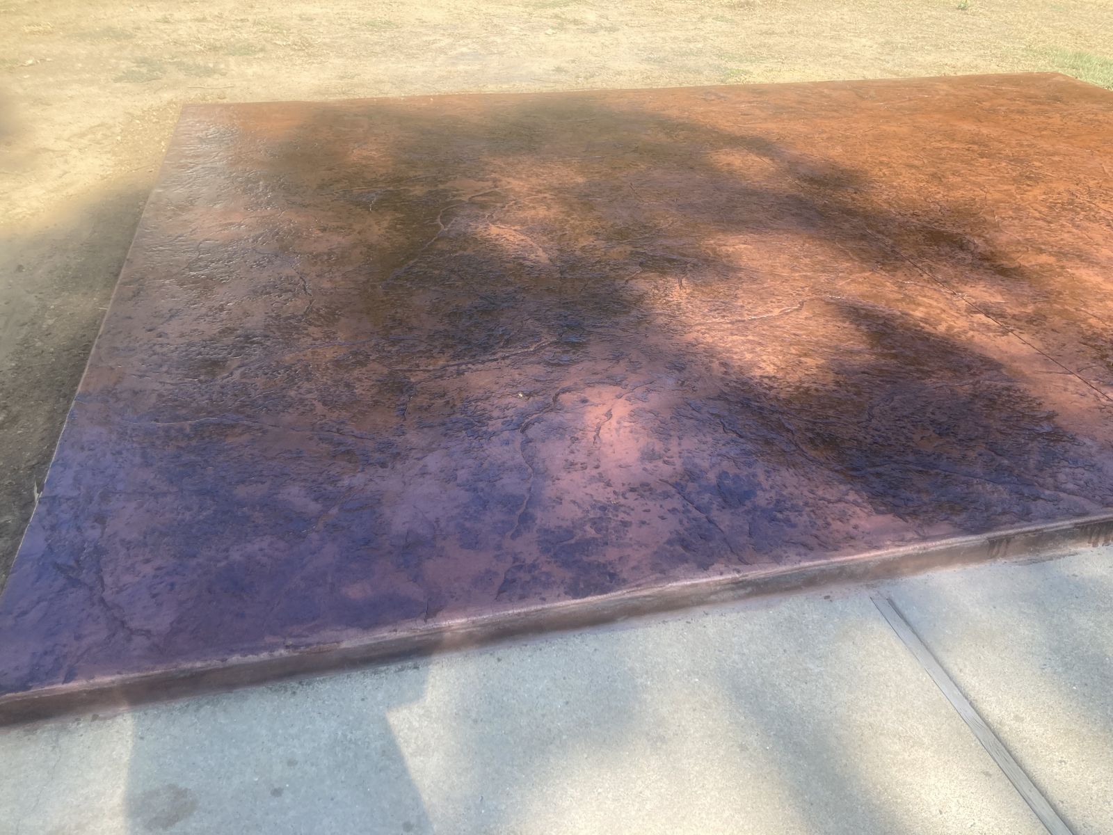 Stained stamped concrete slab in Arkansas