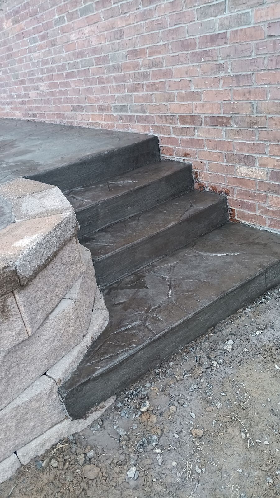 Stamped concrete stairs beside a brick home in Arkansas