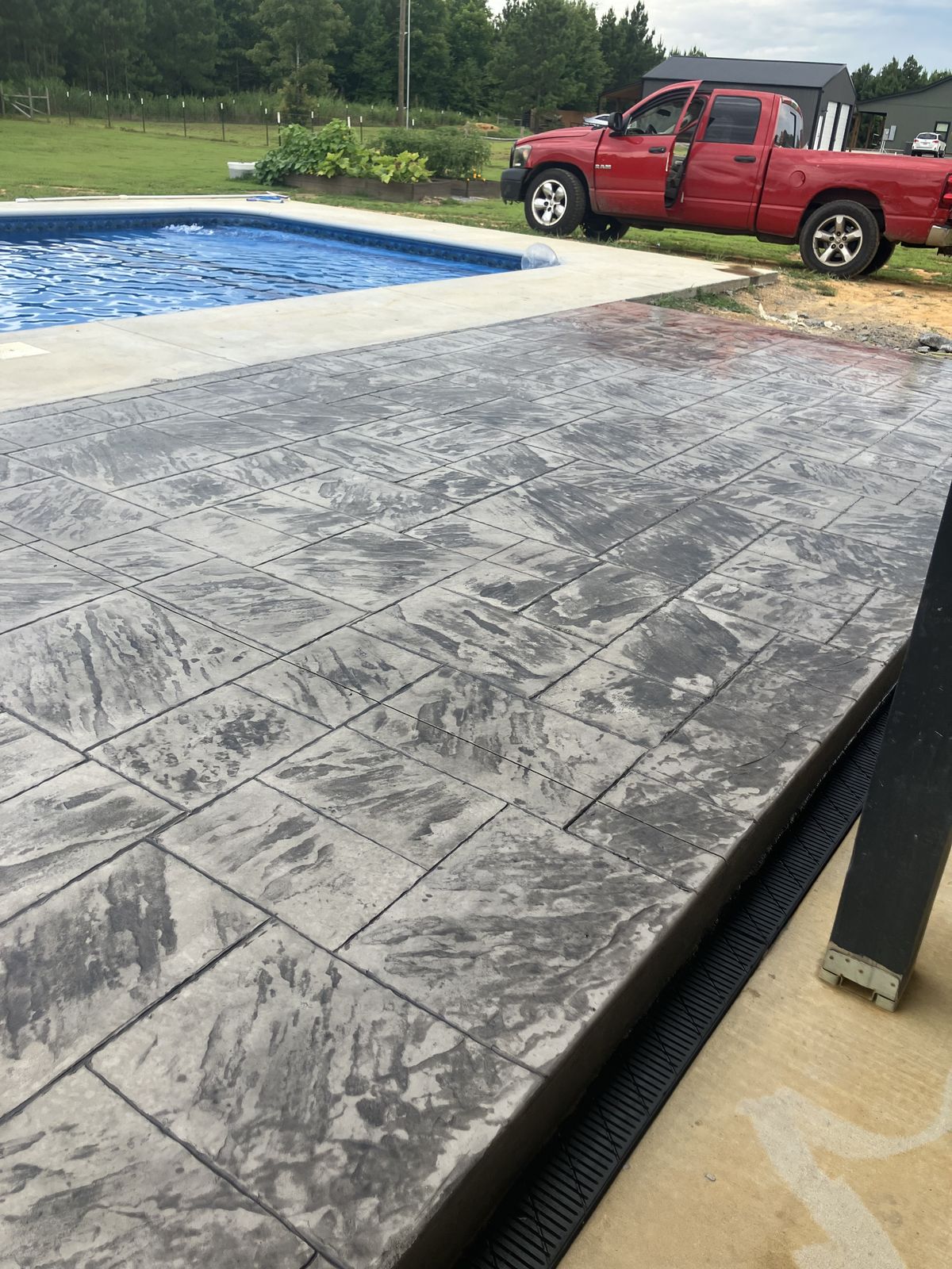 Stamped ashlar pattern concrete pool deck in Arkansas